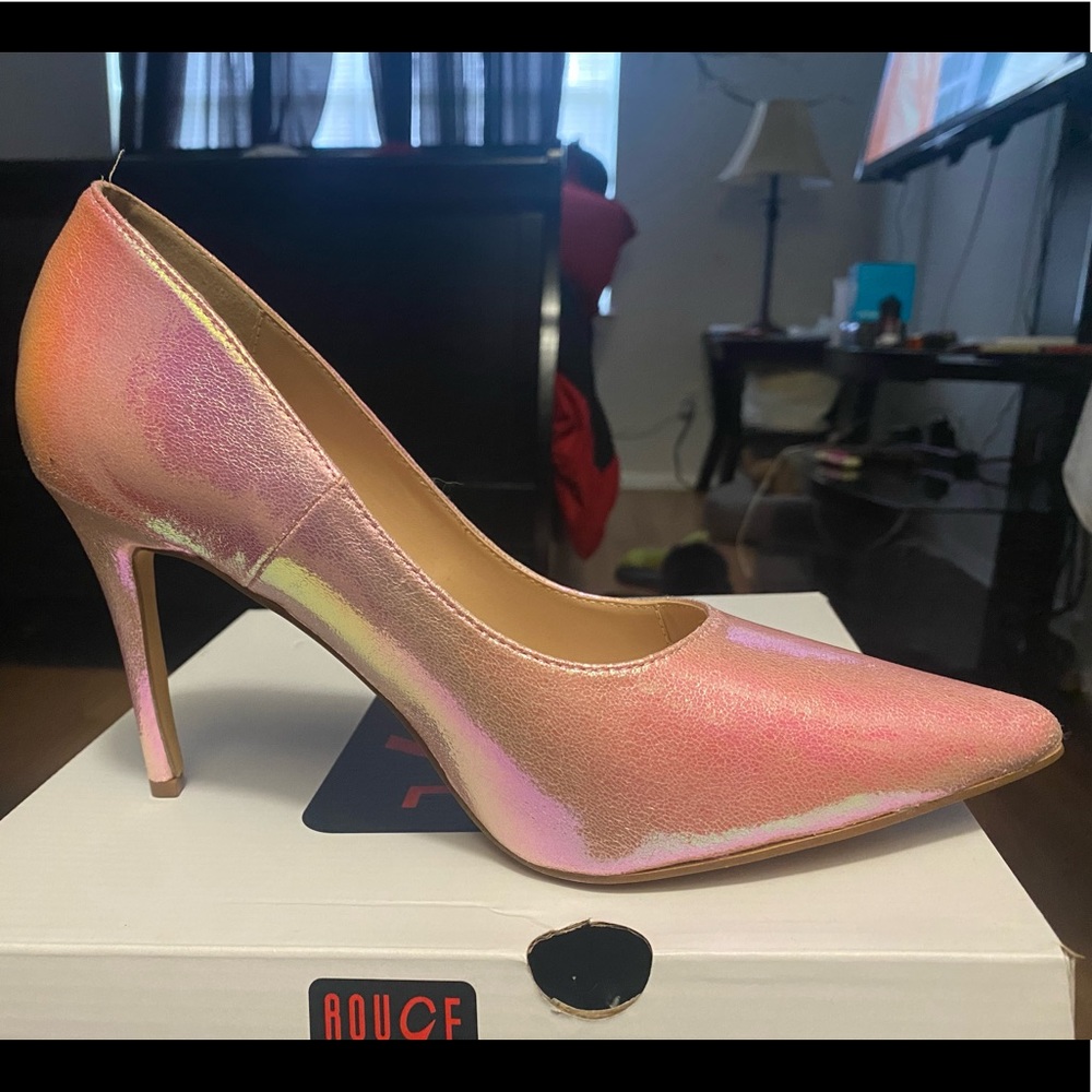 Pink metallic pointy toe heel.